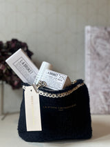 Pochette in teddy blu M