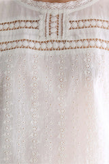 White embroidered sleeveless blouse