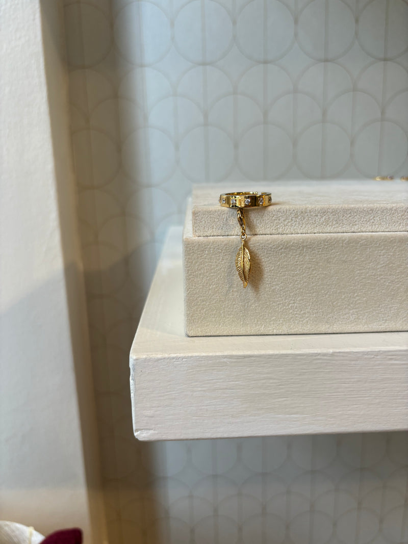 Adjustable ring with feather pendant